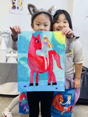 kids showing off her art