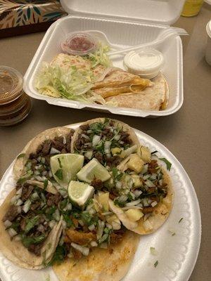 Carne asada and el pastor tacos with a cheese quesadilla.