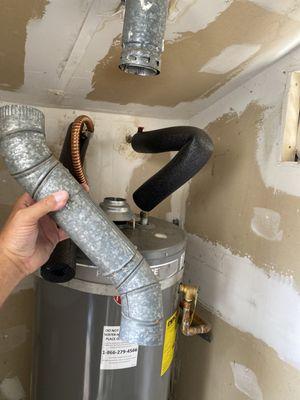 Displaced water heater exhaust vent "Safety Hazard"