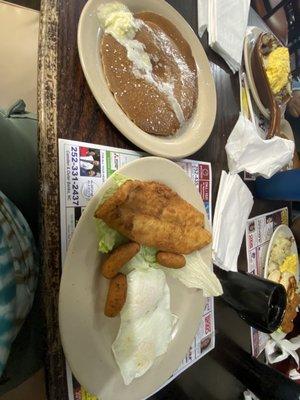 Catfish, hush puppies, eggs and pancakes