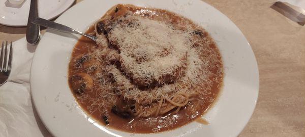 Chicken Marsala with a lot of parm cheese