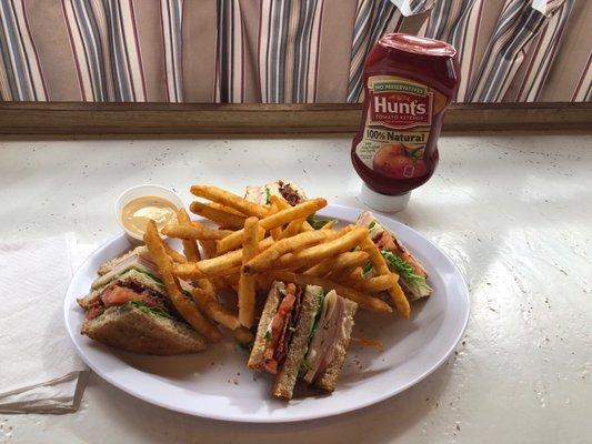 Clubhouse sandwich with Fries Looks and tastes yummy!