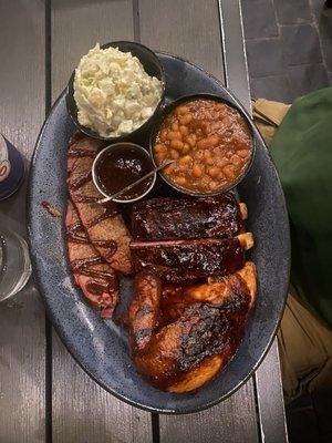 Brisket, ribs, chicken, baked beans, and potato salad