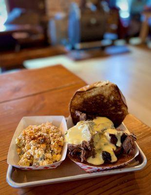 Brisket Sandwich with cheese sauce and street corn salad - all fantastic!! Some of the best brisket I've had outside of Texas!