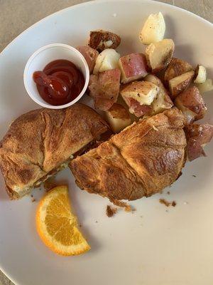 Bacon and egg croissant and potatoes - perfection!