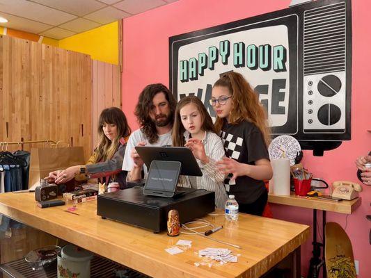 The owners of Happy Hour Vintage, Rebecca and Jake, with two of their daughters on opening day, 3/23/24.