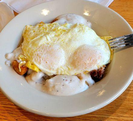 7/29/23  Breakfast bowl Two eggs over easy home fries country gravy sausage