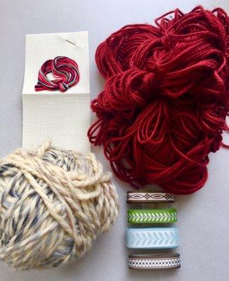 My purchases from a visit to Indigo Hippo.  Two lush balls of yarn, a cross stitch bookmark kit and some cool ribbon.  All for $3.