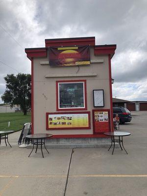 A former coffee shop. No indoor seating, but a couple small tables and decent parking.