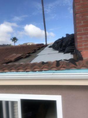 Exposed roof with trash bags left up there