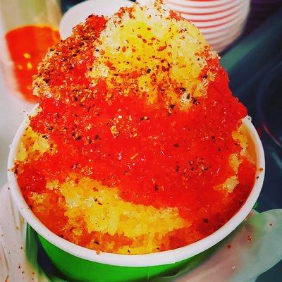 Mangonada shaved ice. With Chamoy and Tajin. Comes with tamarind candy straw.