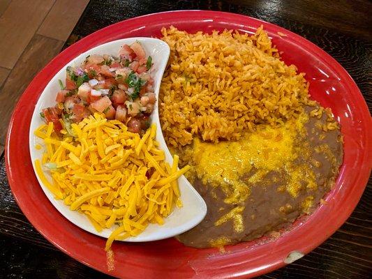 Side of rice and beans with fajitas