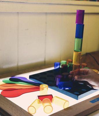 Light Table Peg Board// The children were able to create unique light-up patterns and designs with our translucent pegs and pegboards!