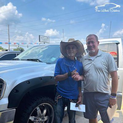 A happy customer with his new truck and Mike Sheffield, owner of Four Wheel Solutions!