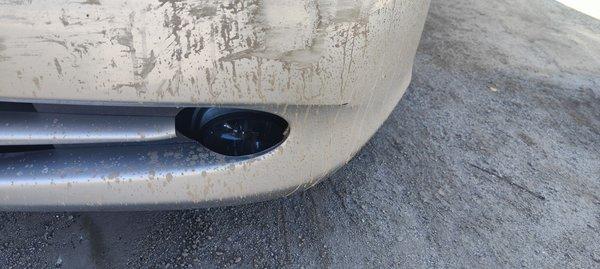 Fog light knocked out from bumper by business