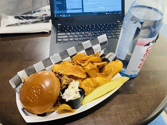 Pulled pork sandwich and chips