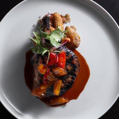 Pork Chop with
cherry peppers "agro dolce", crispy parmesan
fingerling potatoes, toasted fennel pork jus