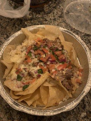 Nachos with shredded beef. White rice. Queso. Pico.