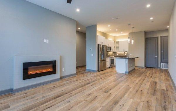 Spacious living room and kitchen with island.