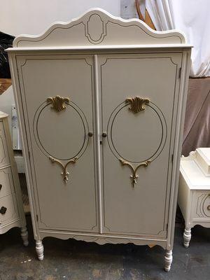 Painted armoire with gold accents