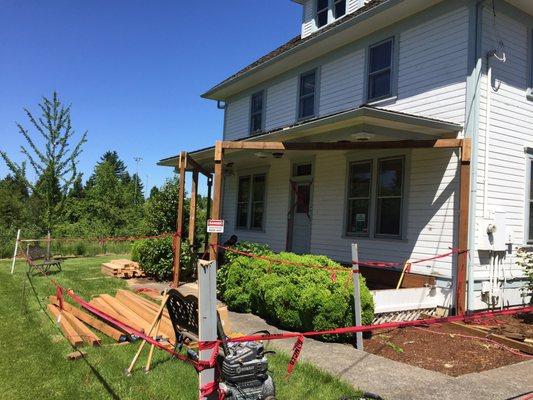 Majic painting and remodeling is replacing the porch