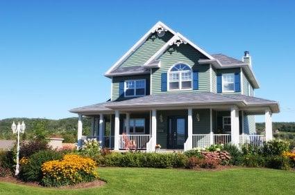 House with new windows, siding, roof, fascia, and gutters.