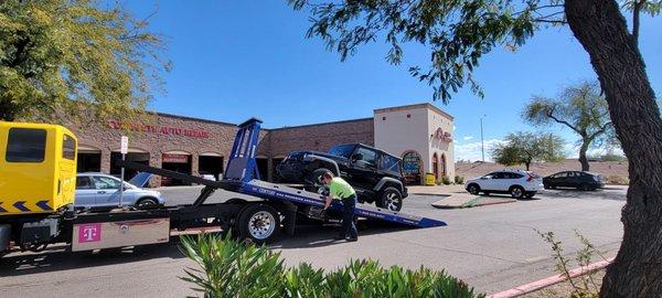 My jeep being towed because they messed it up and now it's not drivable.