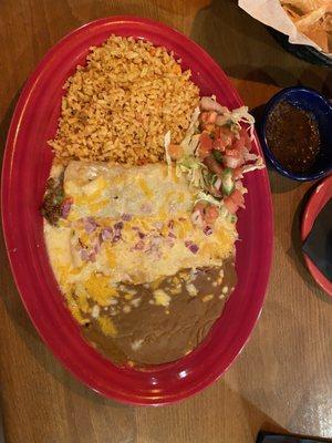 Beef and cheese enchiladas with rice and refried beans