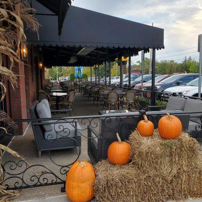 Nicely decorated for Fall with an outdoor dining patio in front of the entrance.   10/18/2023