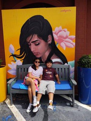 Our kids chilling in front of one of the murals st Hotel Caza