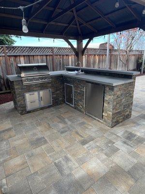 Beautiful BBQ with blue stone, countertop, and layer stone