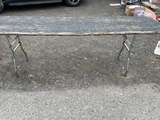 This is one of many tables that Kelly allows sellers to use, at a cost. Seriously? It looks more like kindling for a bonfire.