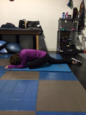 Ziporah in pigeon. One of the many exercises to help with chronic lower back pain.