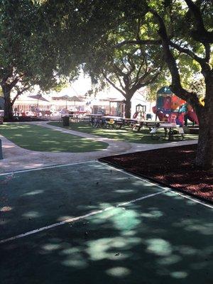 Beautiful playground with plenty of shade and artificial grass to keep the bugs away.