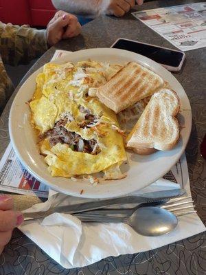 Philly cheese steak omelette. Apparently didn't have enough cheese and too much meat.