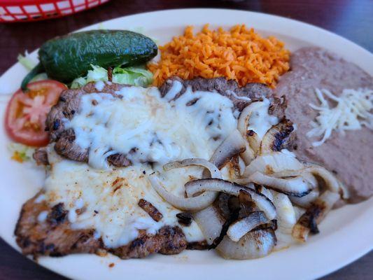 Carne asada.. doesn't normally come with cheese