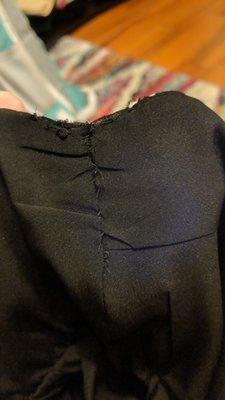 What the seam of my dress looks like after Whiz's third attempt to correct their mistake of making the dress too tight to wear.