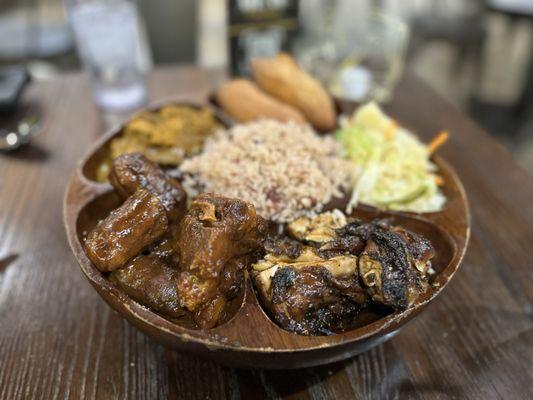 Tour of Jamaica- curry goat, braised oxtails, jerk chicken, festivals, steamed cabbage, rice and peas.