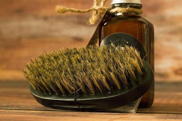 All-natural boar's hair beard brushes are an essential part of of your bearding regimen and are available for sale at the barbershop.