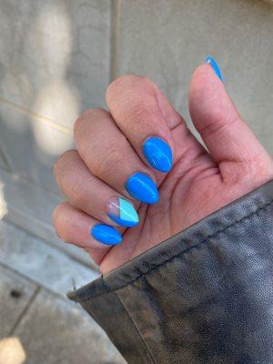 Bright blue with negative space accent nail