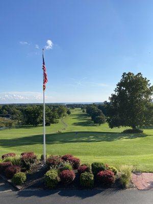 View of our American flag and the Breton Bay golf course from the Ironwood Grille in the clubhouse.