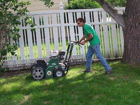 Aerate to relieve your grass roots from compacted soil.