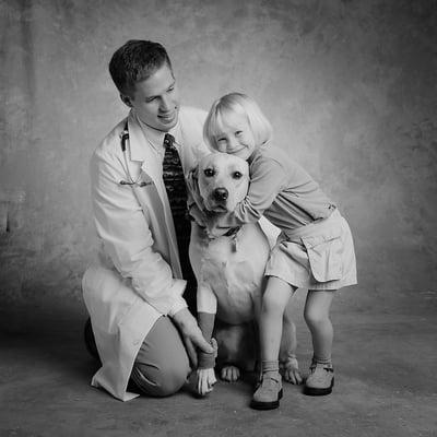 Dr. Conley, his daughter, and their dog.