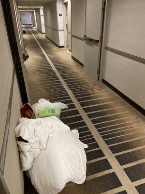 Dirty laundry and trash from previous guests outside our room... at MIDNIGHT STILL THERE