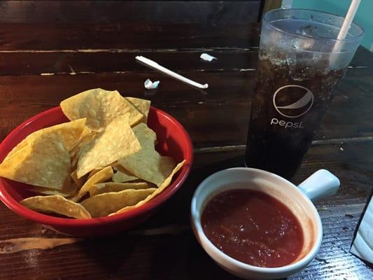 Warm chips and salsa with a hint of heat. So tasty!