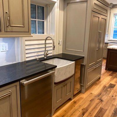 Kitchen with farm sink cutout.