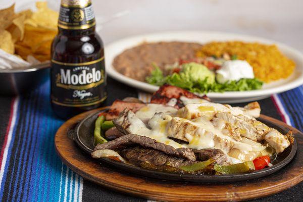 Parrillada Mix - Grilled beef & chicken fajita, smoked sausage with grilled onions & bell peppers.