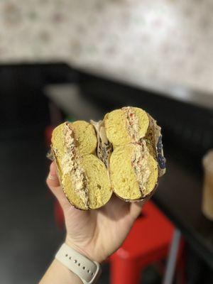 pesto & sundried tomato cream cheese on eggything bagel