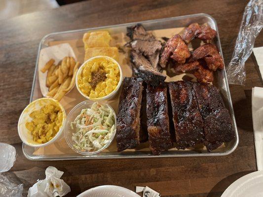 Platter for 2: fries, cornbread, brisket, smoked wings, mac and cheese, coleslaw, beef ribs