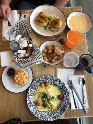 Top down: andouille hustle, cheese grits, tots, beignets, biscuit +jam and the Hey Eddy Omelette.